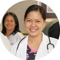 Female doctor wearing white lab coat and a stethoscope draped over her shoulders